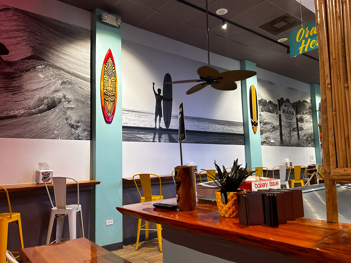 metal chairs and tables with surfing and hawaiian decor